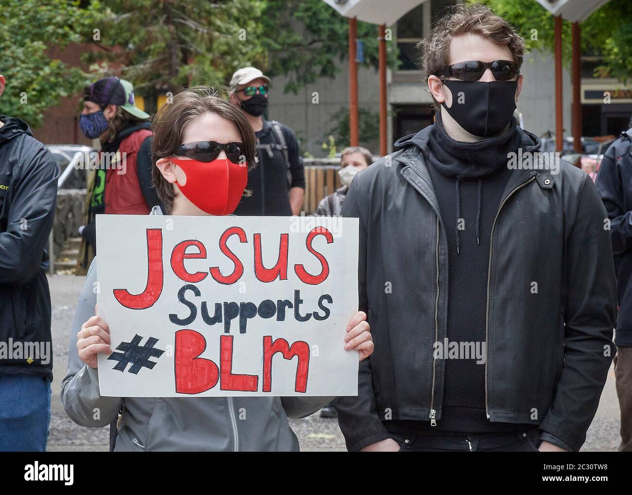 A woman holds a sign at a June 7, 2020, Black Lives Matter protest in Eugene, Oregon. Stock Photo
