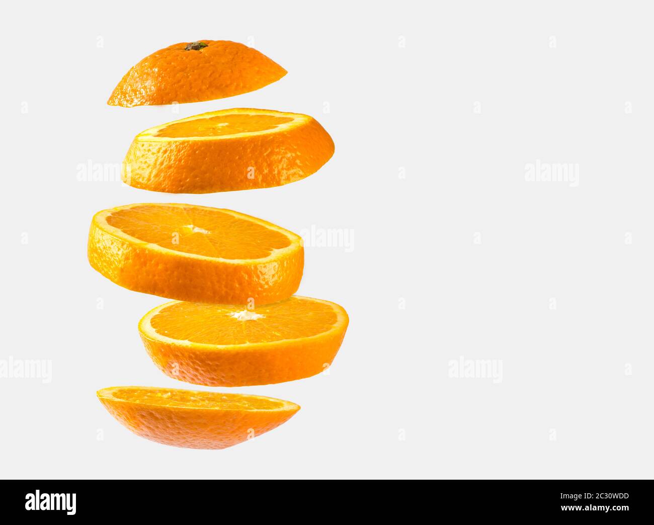 Orange sliced floating on white background Stock Photo