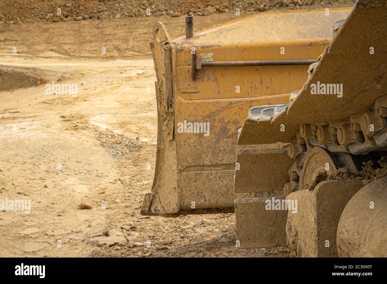 excavator summarizes soil on construction site in summer season Stock ...
