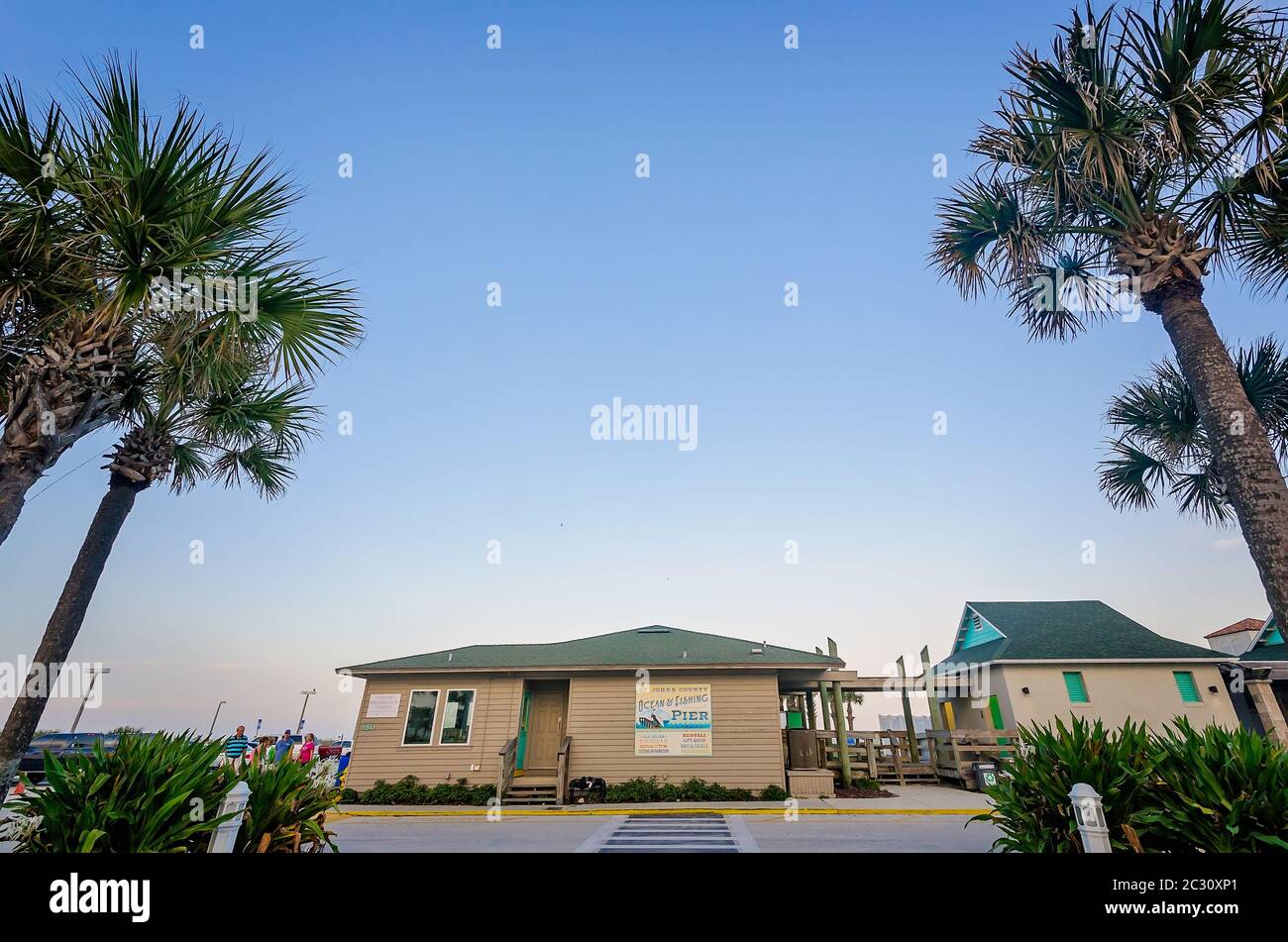 Pine trees flank the entrance to St. Johns County Ocean Pier, April 14, 2015, in St. Augustine, Florida. Stock Photo