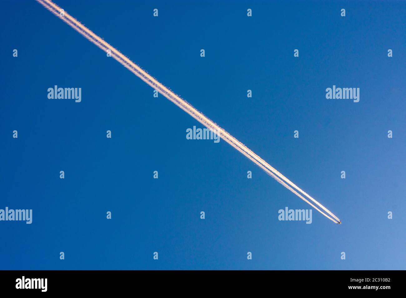 : 4 jet aircraft, contrails, blue sky in , , Austria Stock Photo