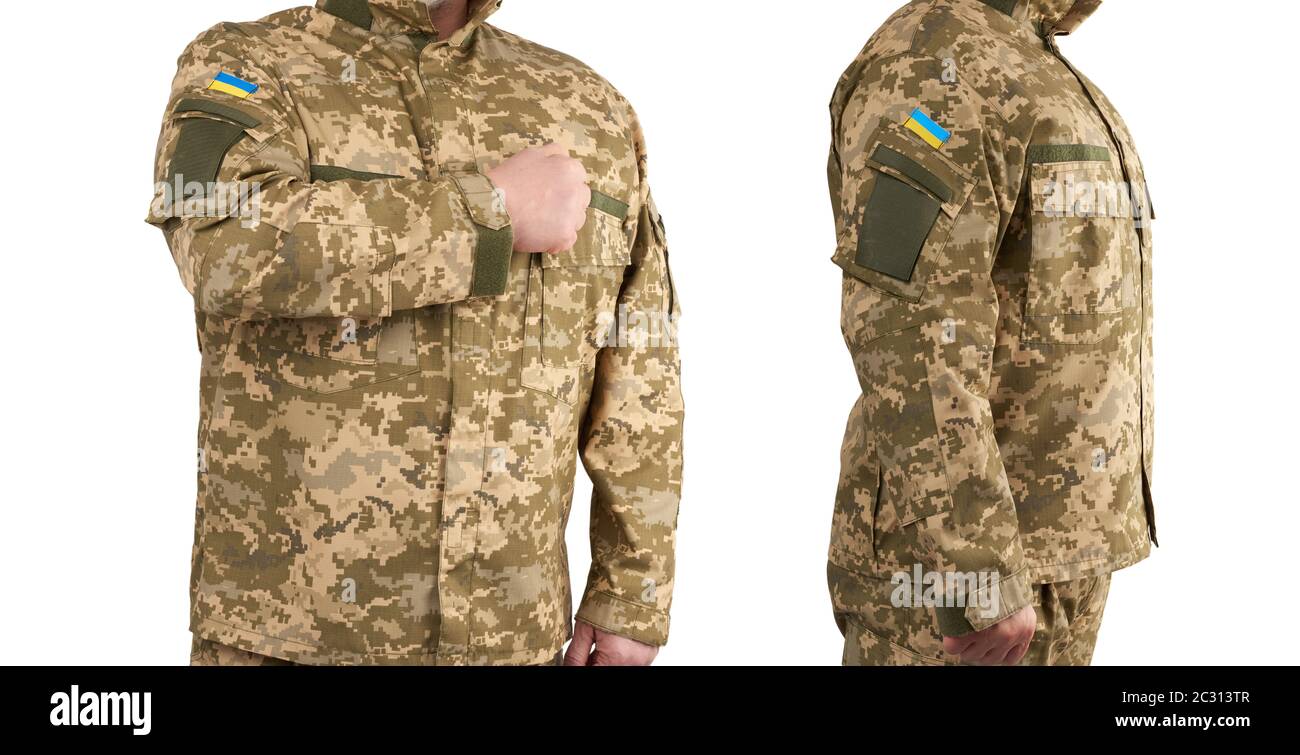 Ukrainian man warrior dressed in a military pixel uniform stands on a ...