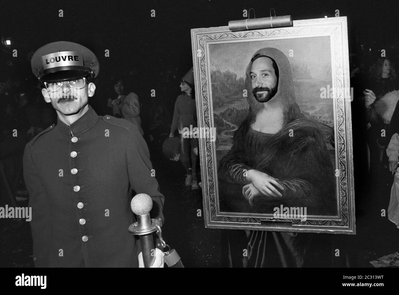 Mona Lisa costume at the Greenwich Village Halloween Parade, New York City, USA in the 1980's  Photographed with Black & White film at night. Stock Photo