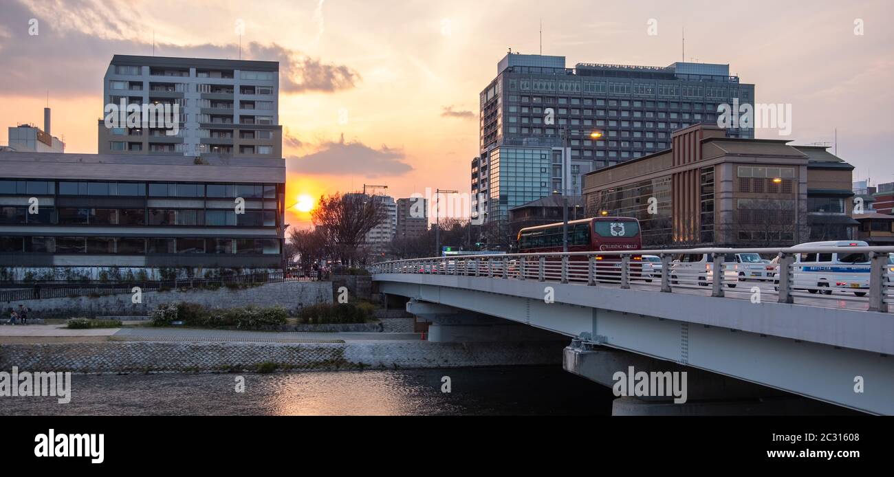 Modern bridge across Kamo River, Kyoto, Japan at sunset, Stock Photo