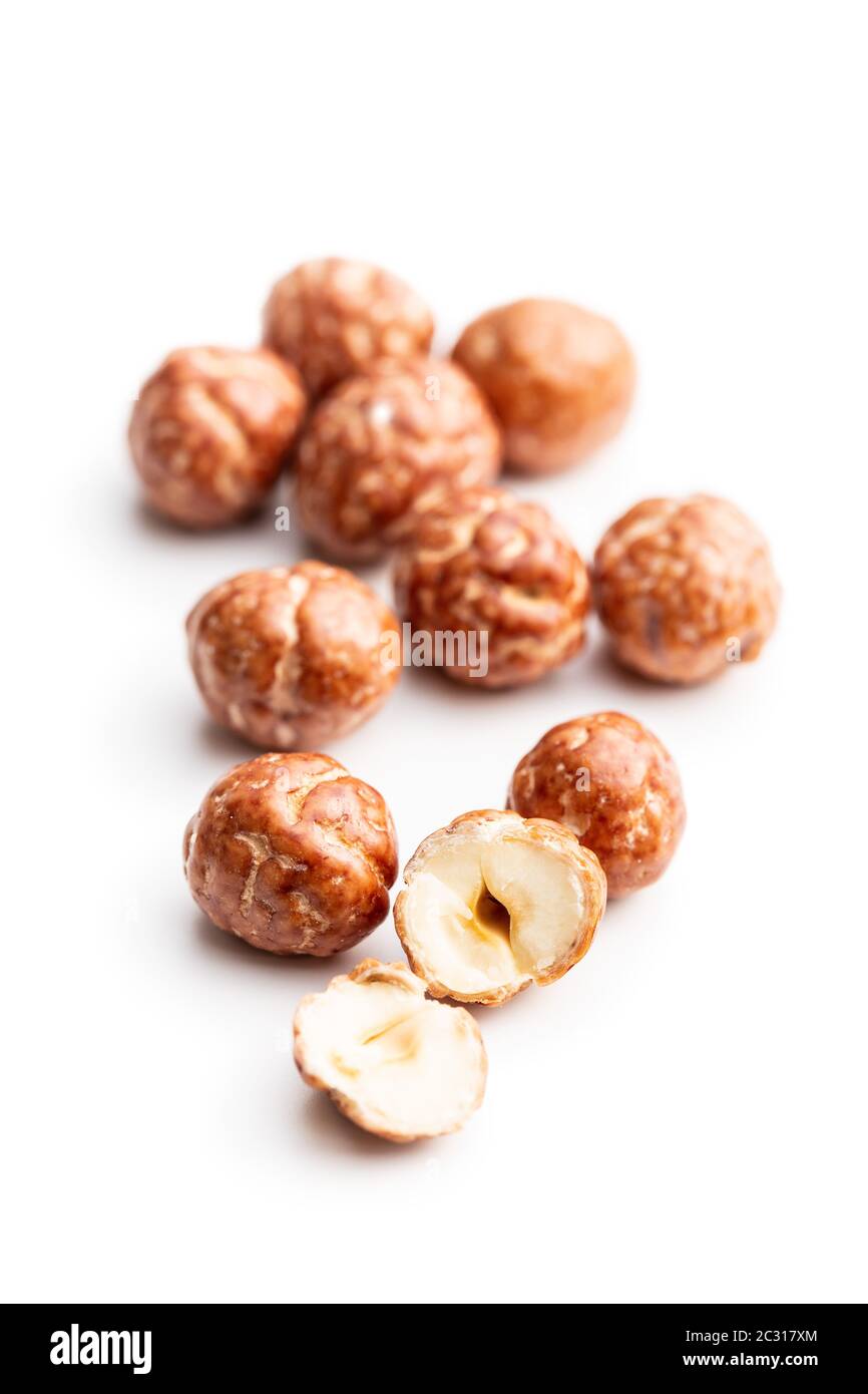 Hazelnuts with sugar icing isolated on white background. Stock Photo