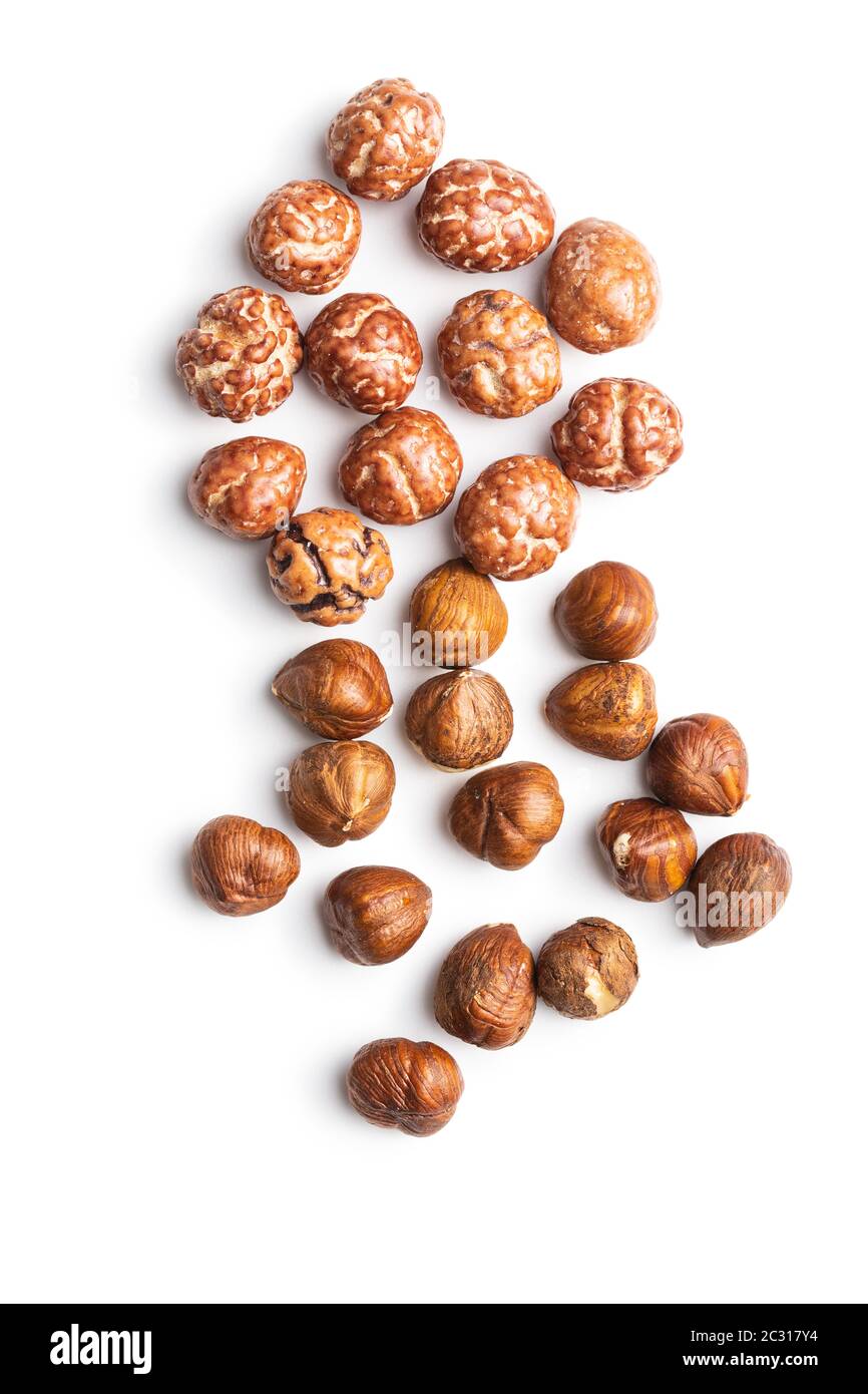 Hazelnuts with sugar icing isolated on white background. Stock Photo