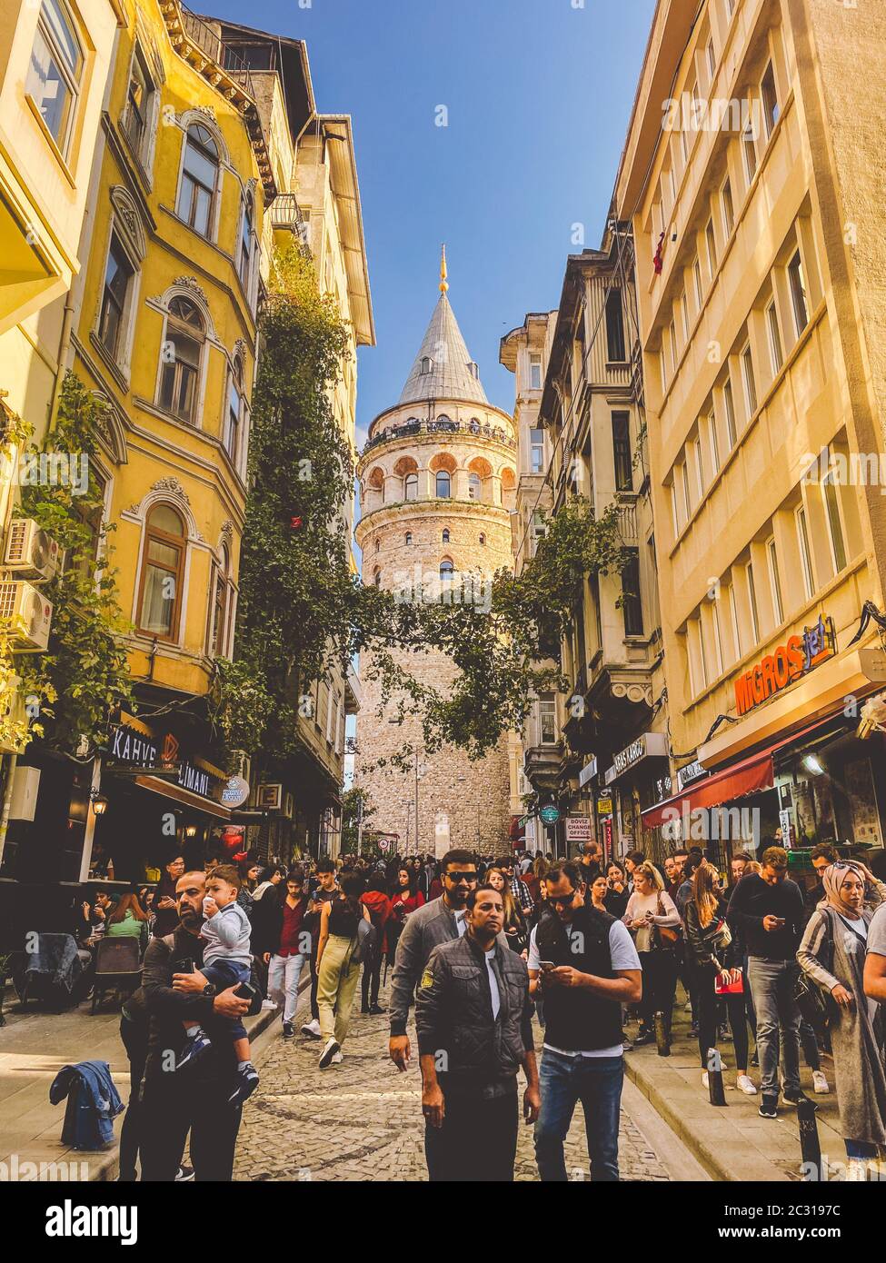 Galata Tower and the street in the Old Town of Istanbul, Turkey October 27, 2019. BELTUR Galata Kulesi or Galata tower in the ol Stock Photo