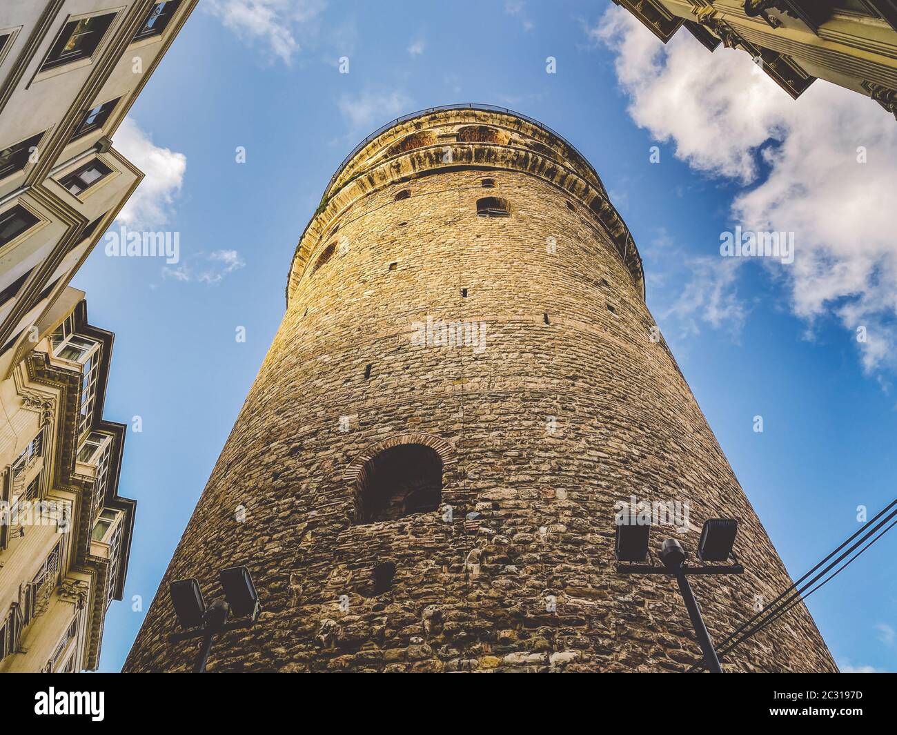 Galata Tower and the street in the Old Town of Istanbul, Turkey October 27, 2019. BELTUR Galata Kulesi or Galata tower in the ol Stock Photo