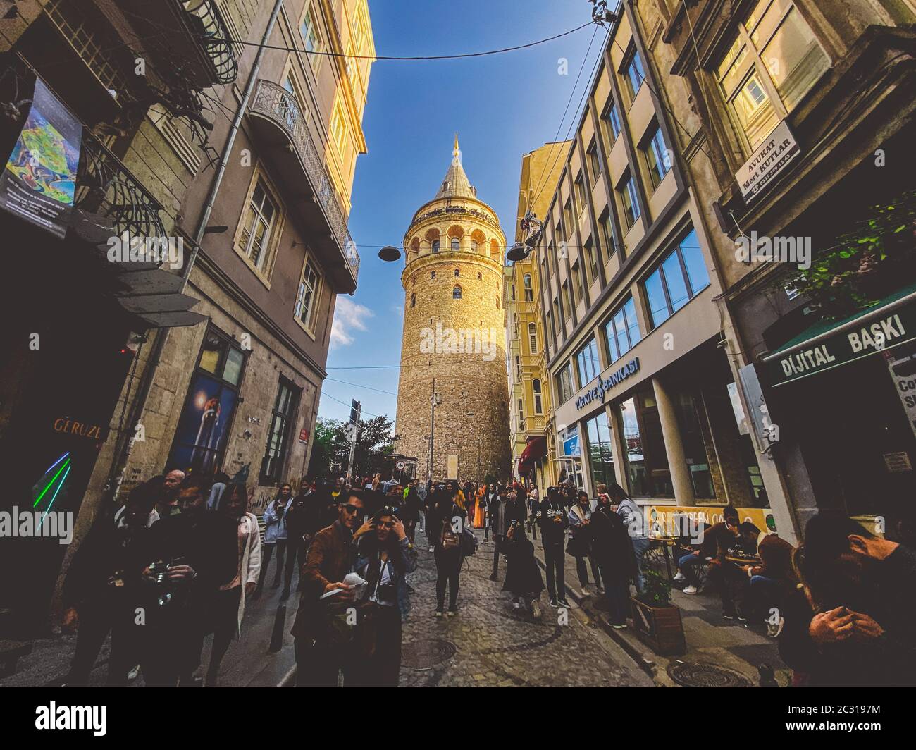 Galata Tower and the street in the Old Town of Istanbul, Turkey October 27, 2019. BELTUR Galata Kulesi or Galata tower in the ol Stock Photo