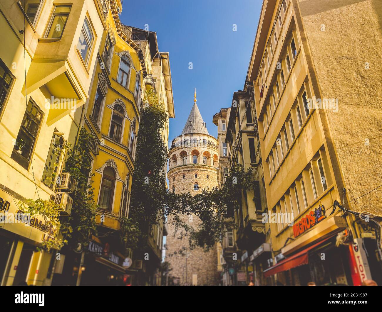 Galata Tower and the street in the Old Town of Istanbul, Turkey October 27, 2019. BELTUR Galata Kulesi or Galata tower in the ol Stock Photo