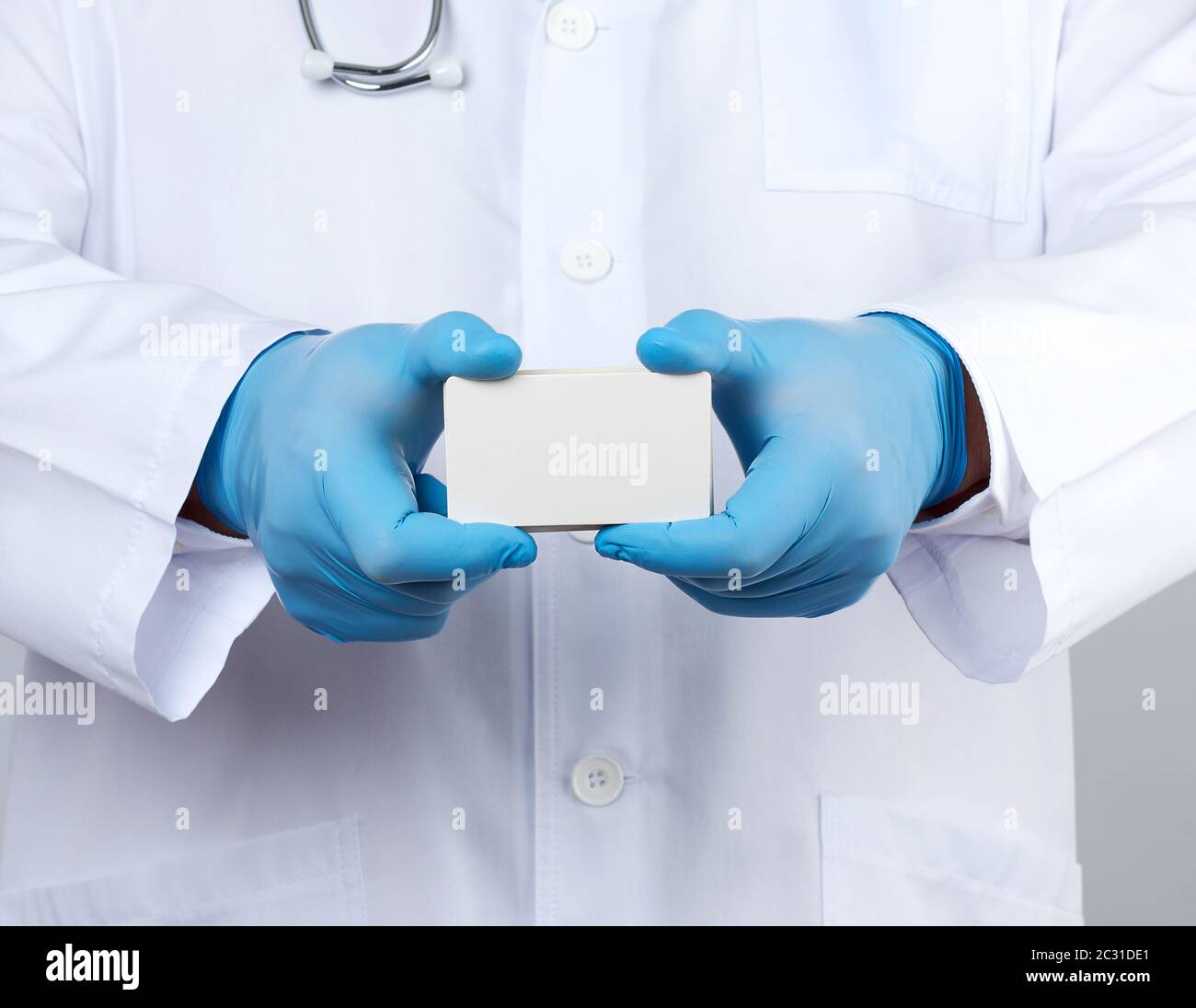 adult doctor therapist is dressed in a white robe uniform and blue ...
