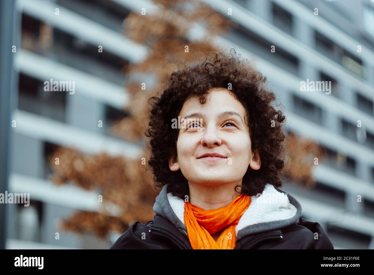 Young confident woman portrait outdoors. Analog film look. Authentic millenial young girl concept. Stock Photo