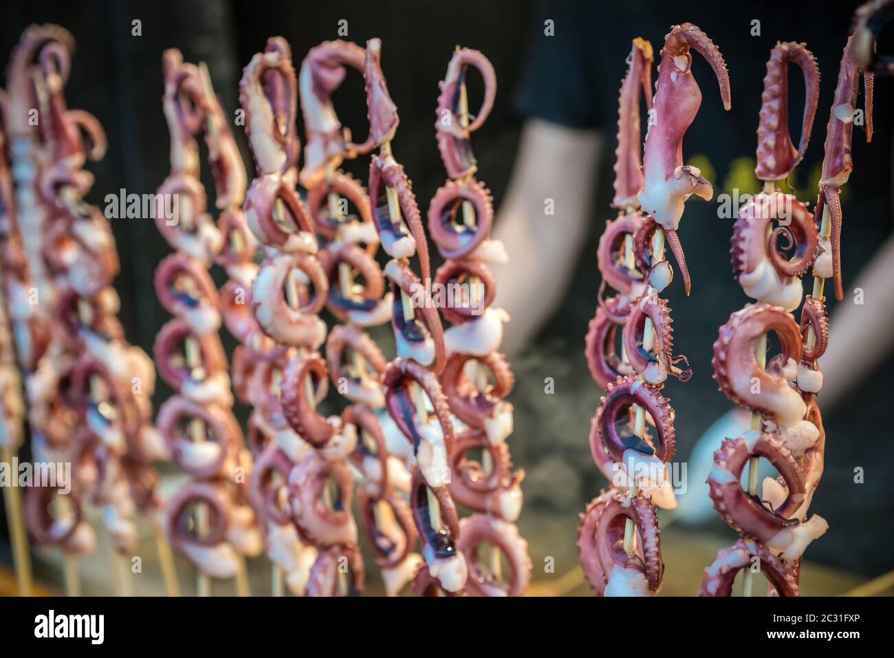 Baby octopus meat on sticks Stock Photo Alamy