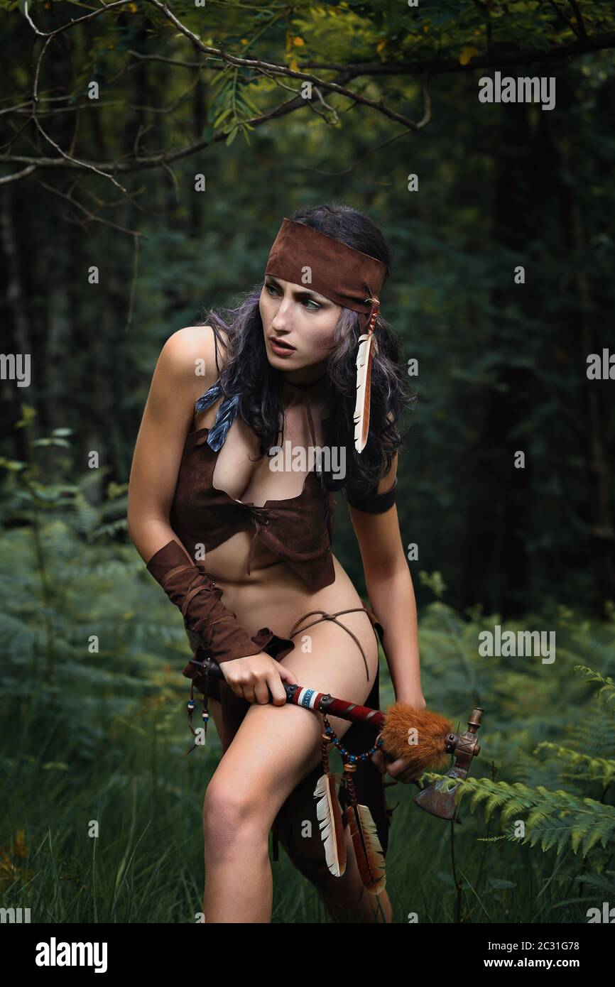 Female american indian warrior in the forest Stock Photo