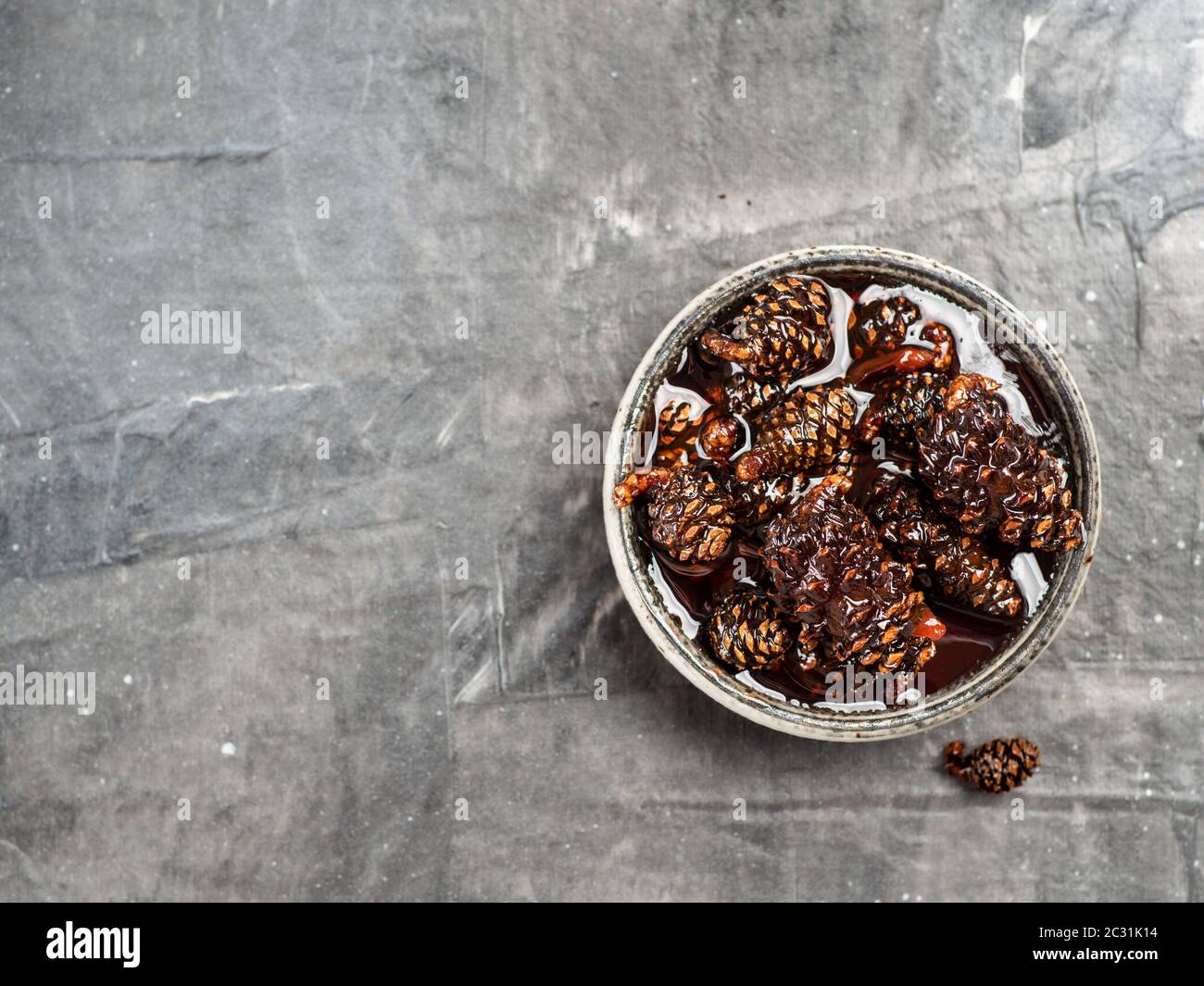 Jam with baby pine cones Stock Photo