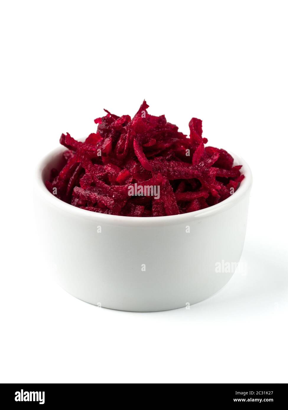 Grated beetroot in ceramic bowl isolated on white Stock Photo