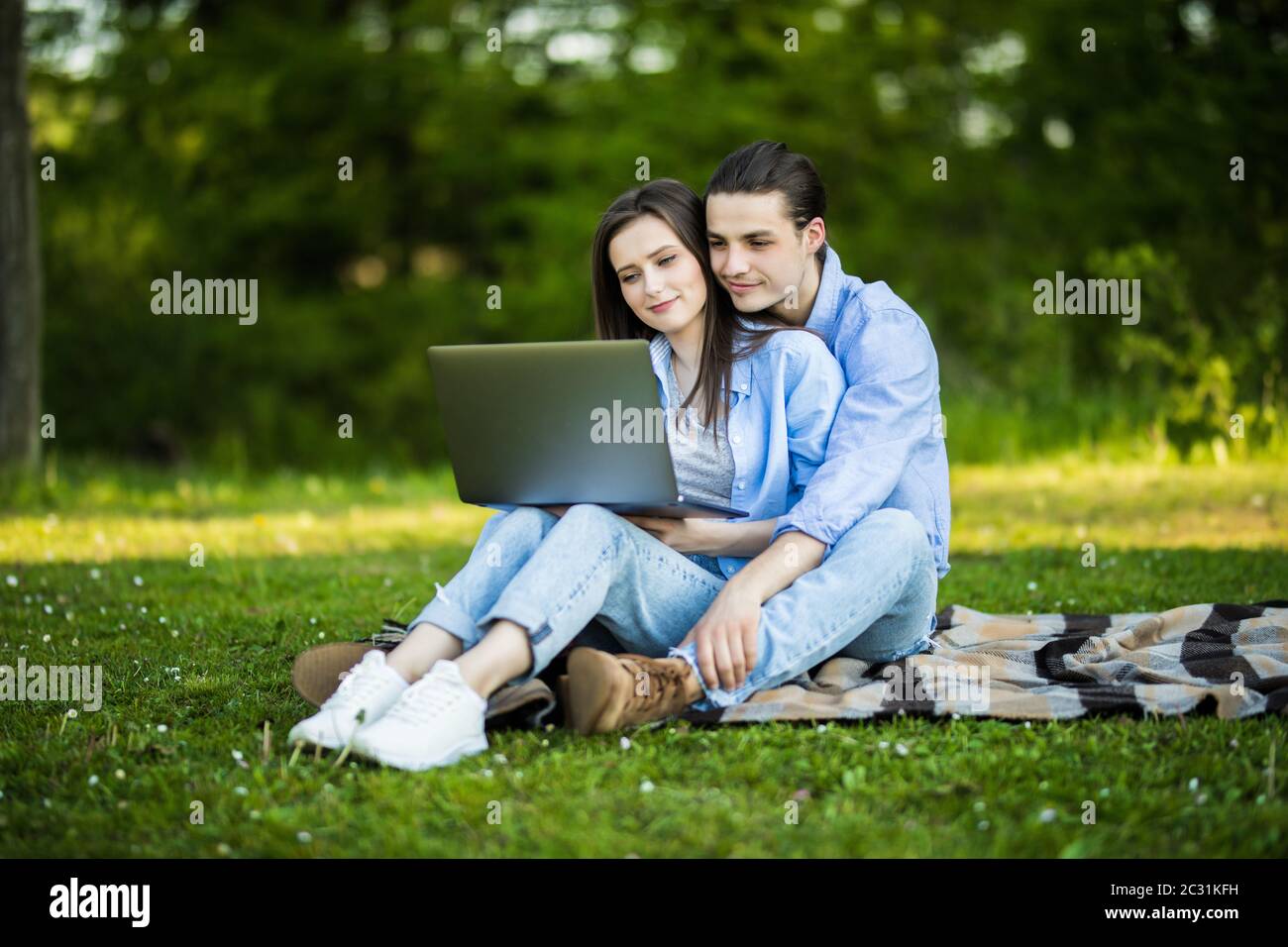 Man Woman Laptop Smiling Lying Happiness Grass Two People High Resolution Stock Photography And Images Alamy