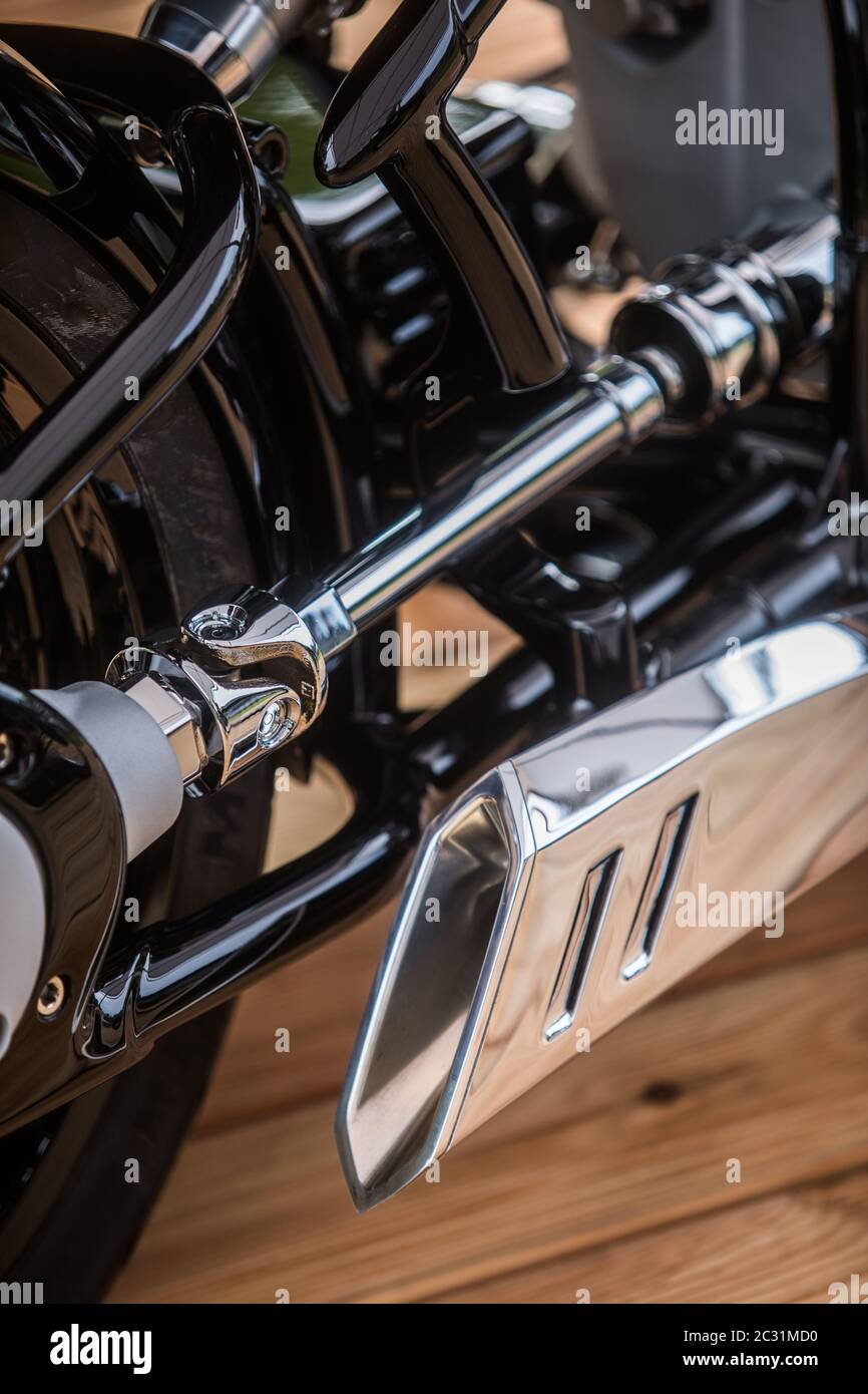 Close up of a new motorcycle shaft and shiny exhaust pipe. Stock Photo