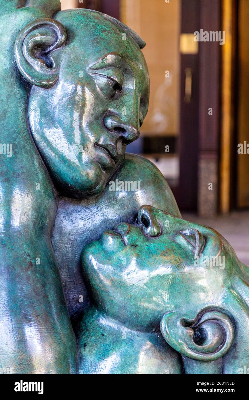 Close-up of 'Returning to Embrace' sculpture by Jon Buck at 10 Cabot Square, art in Canary Wharf, London, UK Stock Photo
