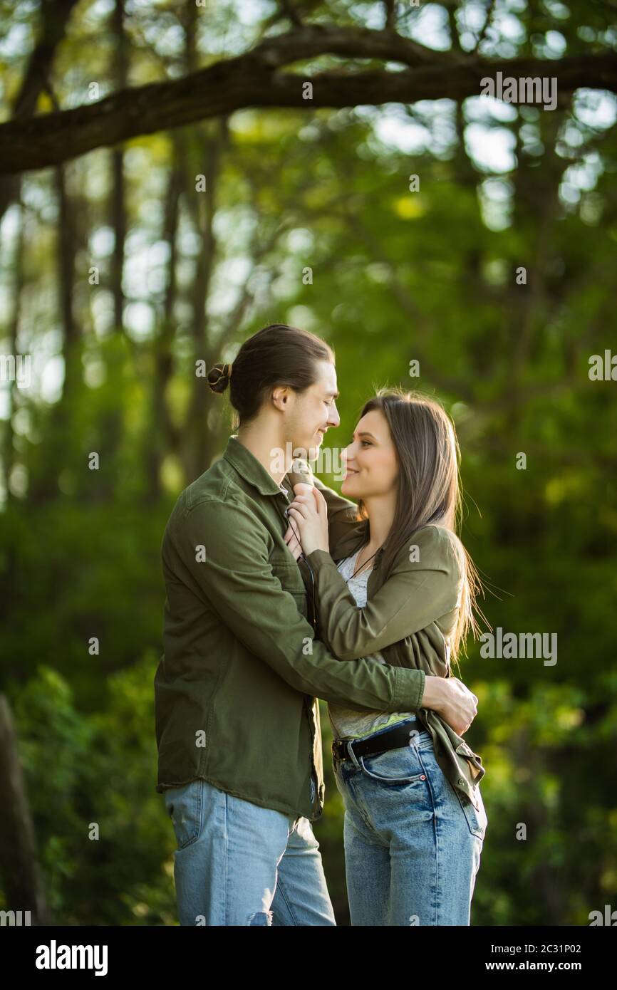 Happy Young Couple Hugging And Laughing Outdoors Stock Image   Image