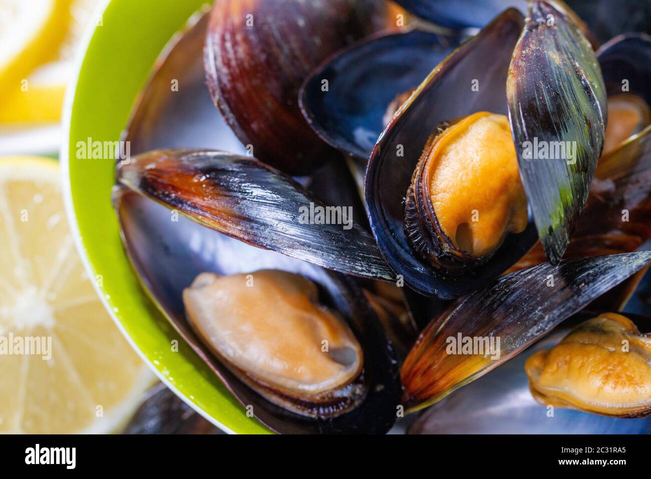 Cooked mussels served on a plate Stock Photo