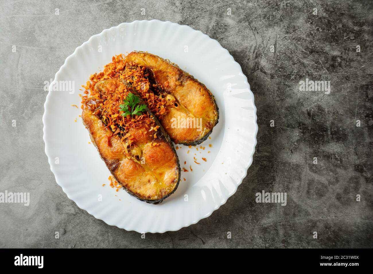 Deep Fried Pangasius fish with Black Pepper Garlic and fish source, quick and easy dish. Stock Photo