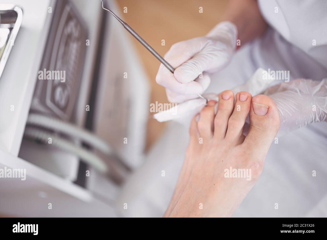 Professional medical pedicure procedure close up using double nail