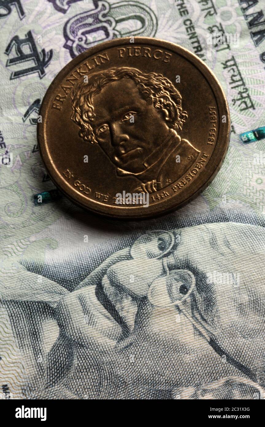 One dollar American coin on Indian currency Stock Photo