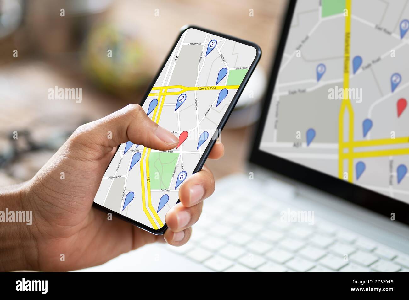 Close-up Of A Person's Hand Using GPS Navigation Map On Mobile Phone ...