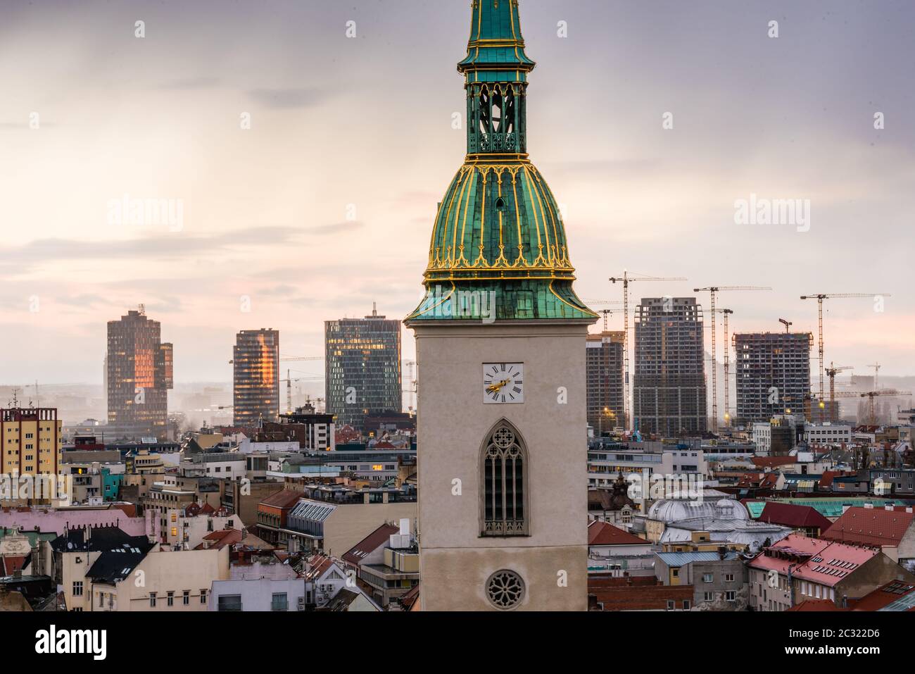 Cityscape of Bratislava, Slovakia with St. Martin's Cathedral and Modern Office Buildings in Background at Sunrise Stock Photo