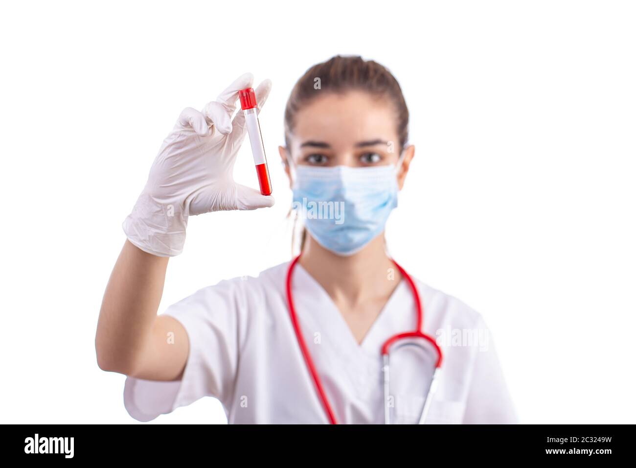 Woman examining blood sample hi-res stock photography and images - Alamy