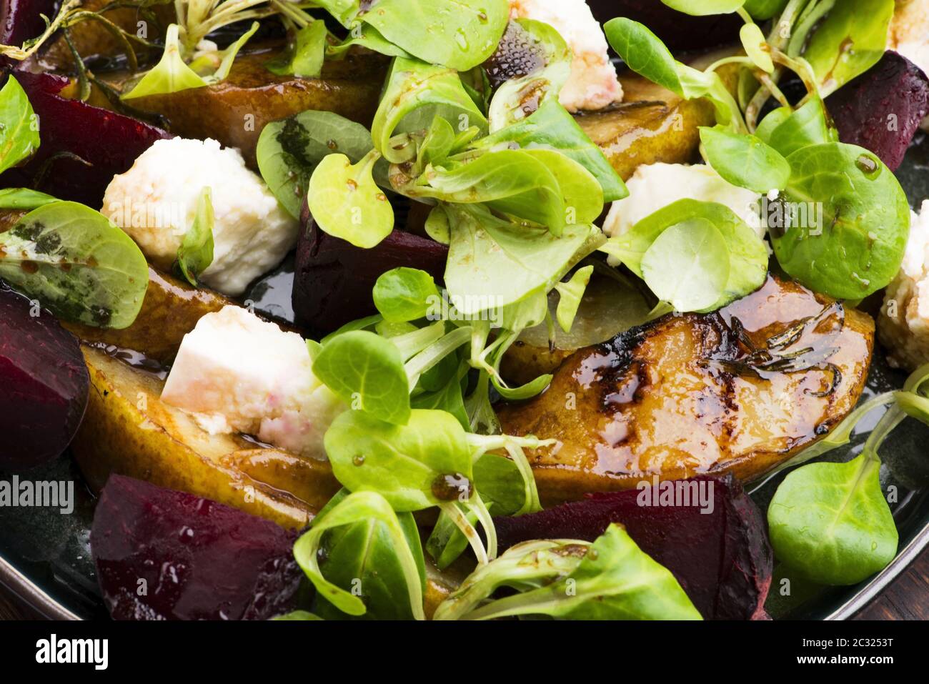 Salad of roasted beetroot, pear, lamb's lettuce, cheese Stock Photo