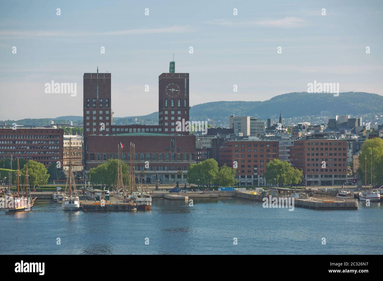 OSLO, NORWAY - MAY 27, 2017: Harbor and red brick City Hall (Radhuset) of Oslo, Norway. City Hall designed by Arnstein Arneberg and Magnus Poulsson. Stock Photo