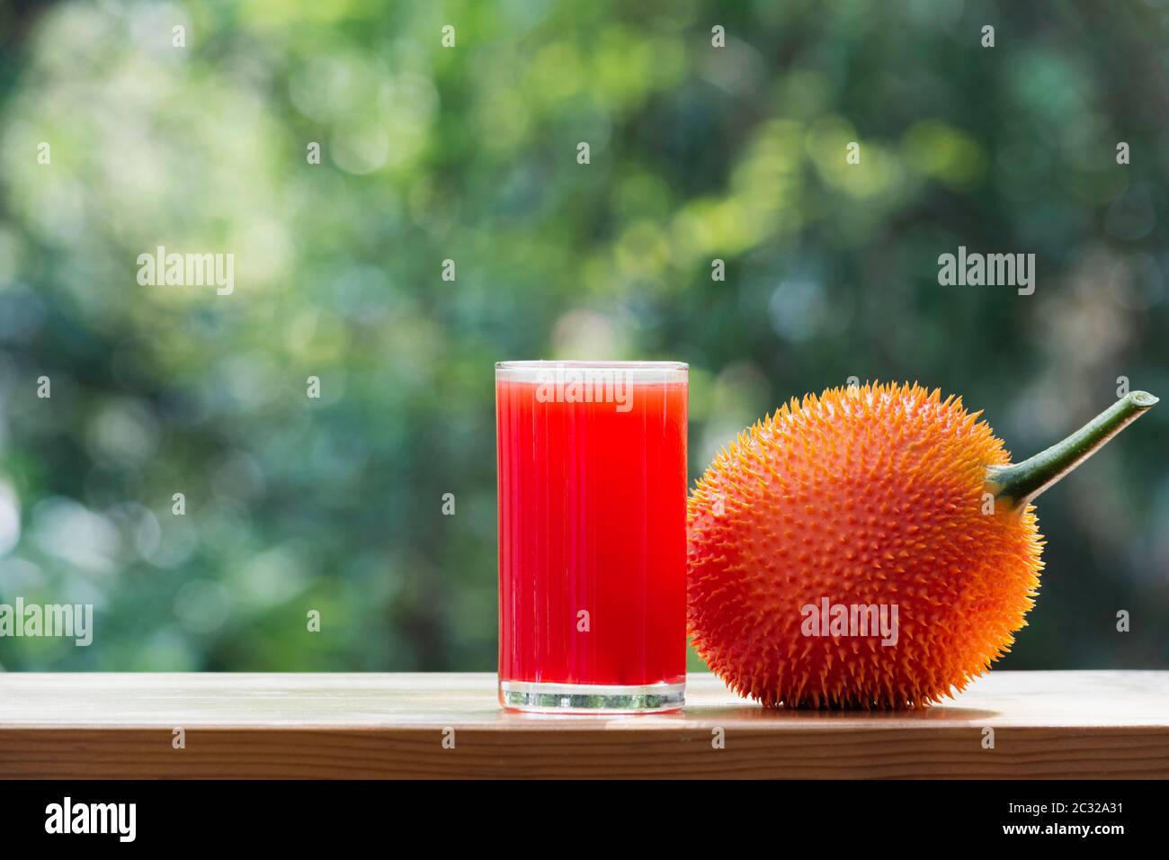 Baby Jackfruit, Gac fruit with baby jackfruit juice on blurred background. Drink and healthy concept. Stock Photo