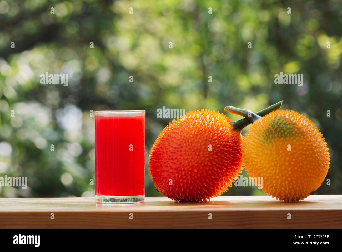 Baby Jackfruit, Gac fruit with baby jackfruit juice on blurred background. Drink and healthy concept. Stock Photo