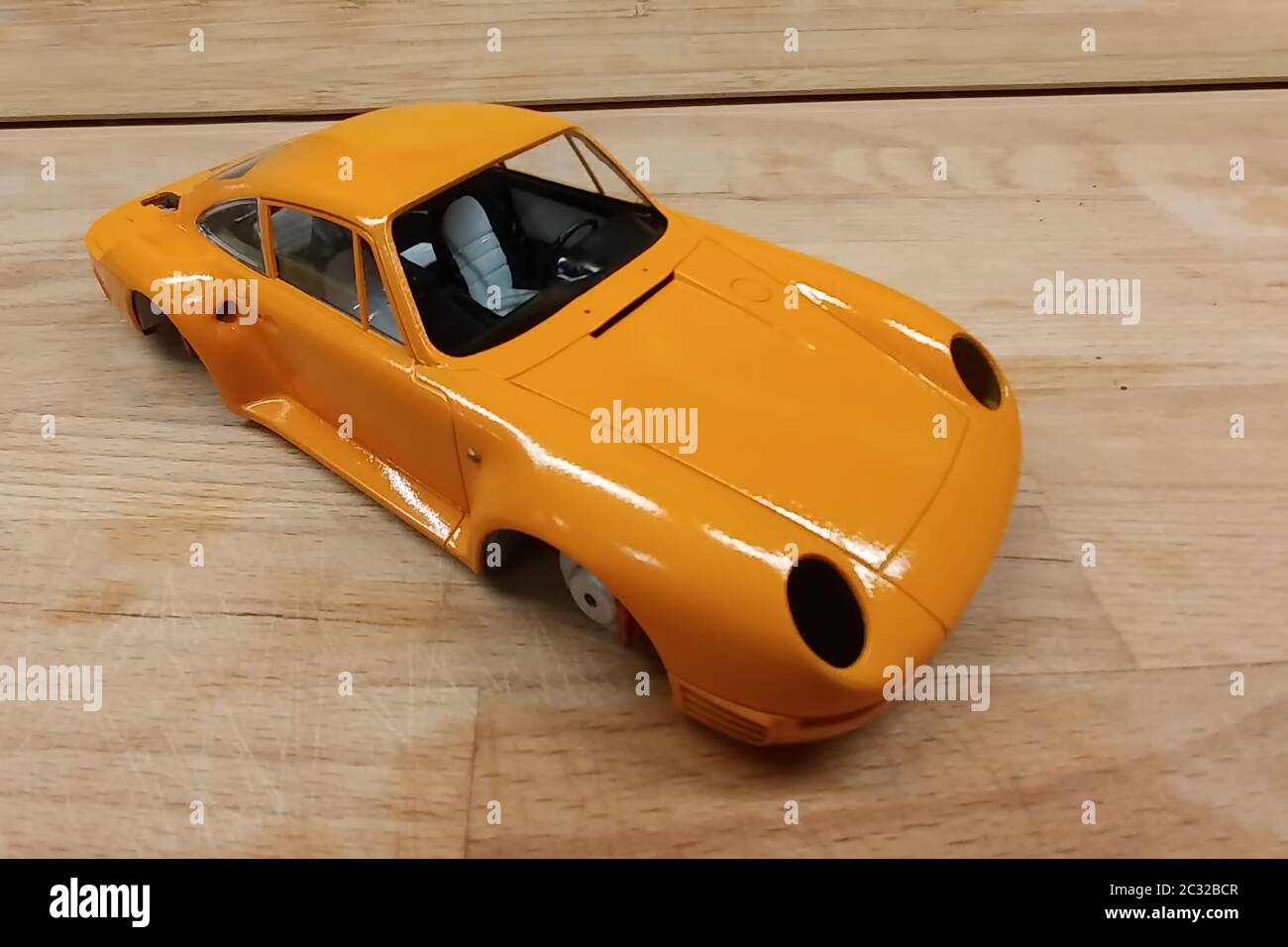The process of assembling and painting the scale model of the car