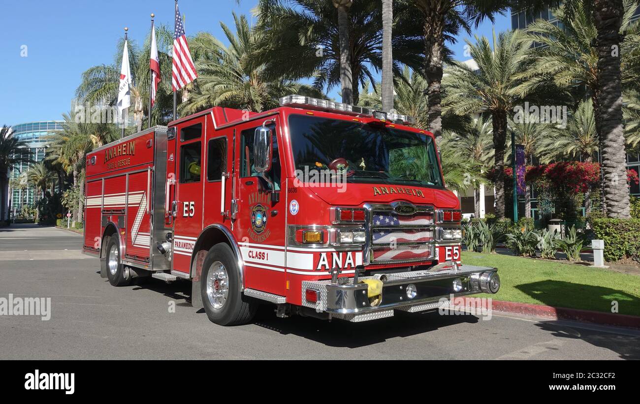 A city of Anaheim fire truck parked near the convention center, flags and palm trees in the background Stock Photo