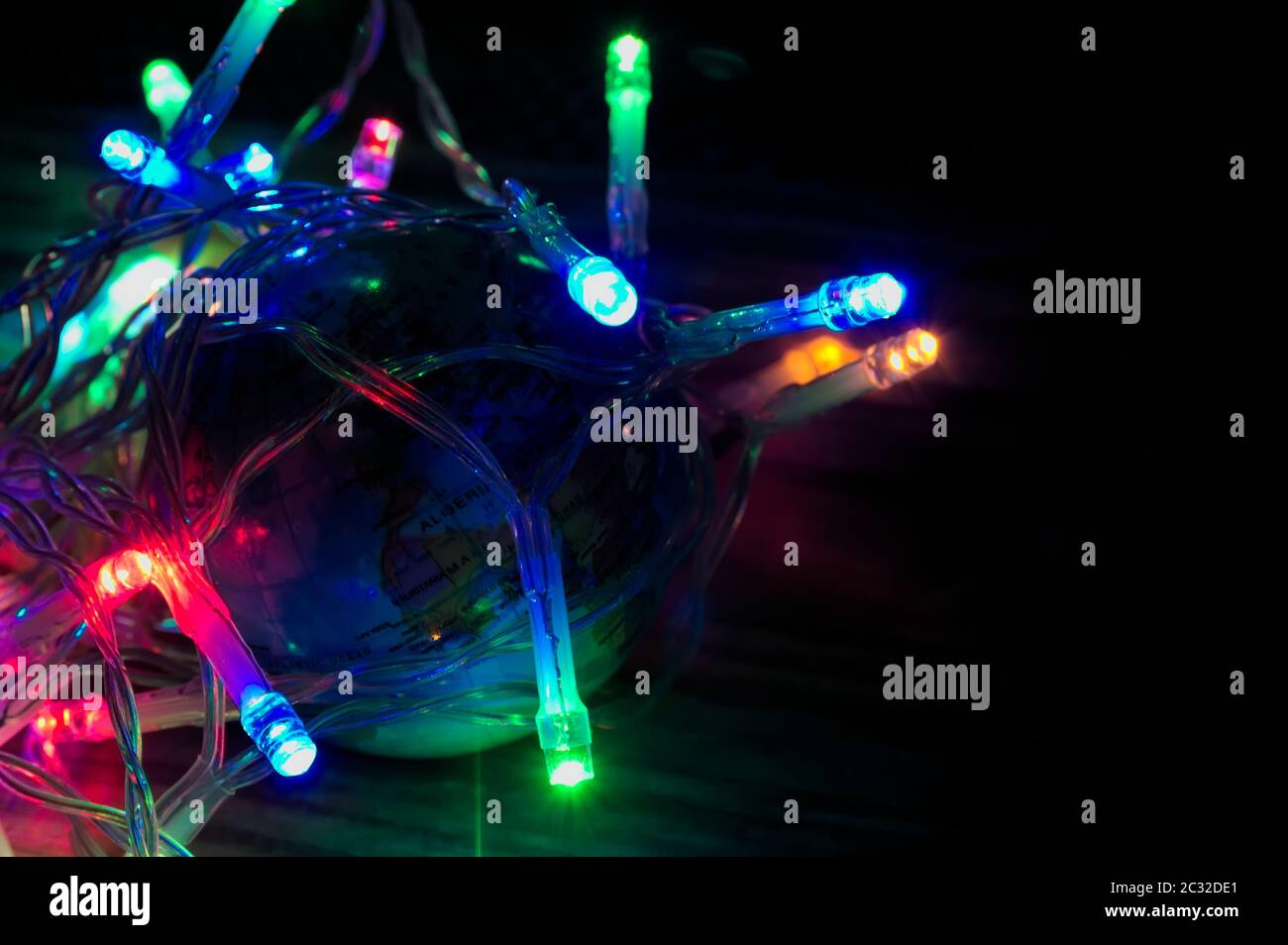 A globe surrounded by led lights symbolizing the excess of artificial