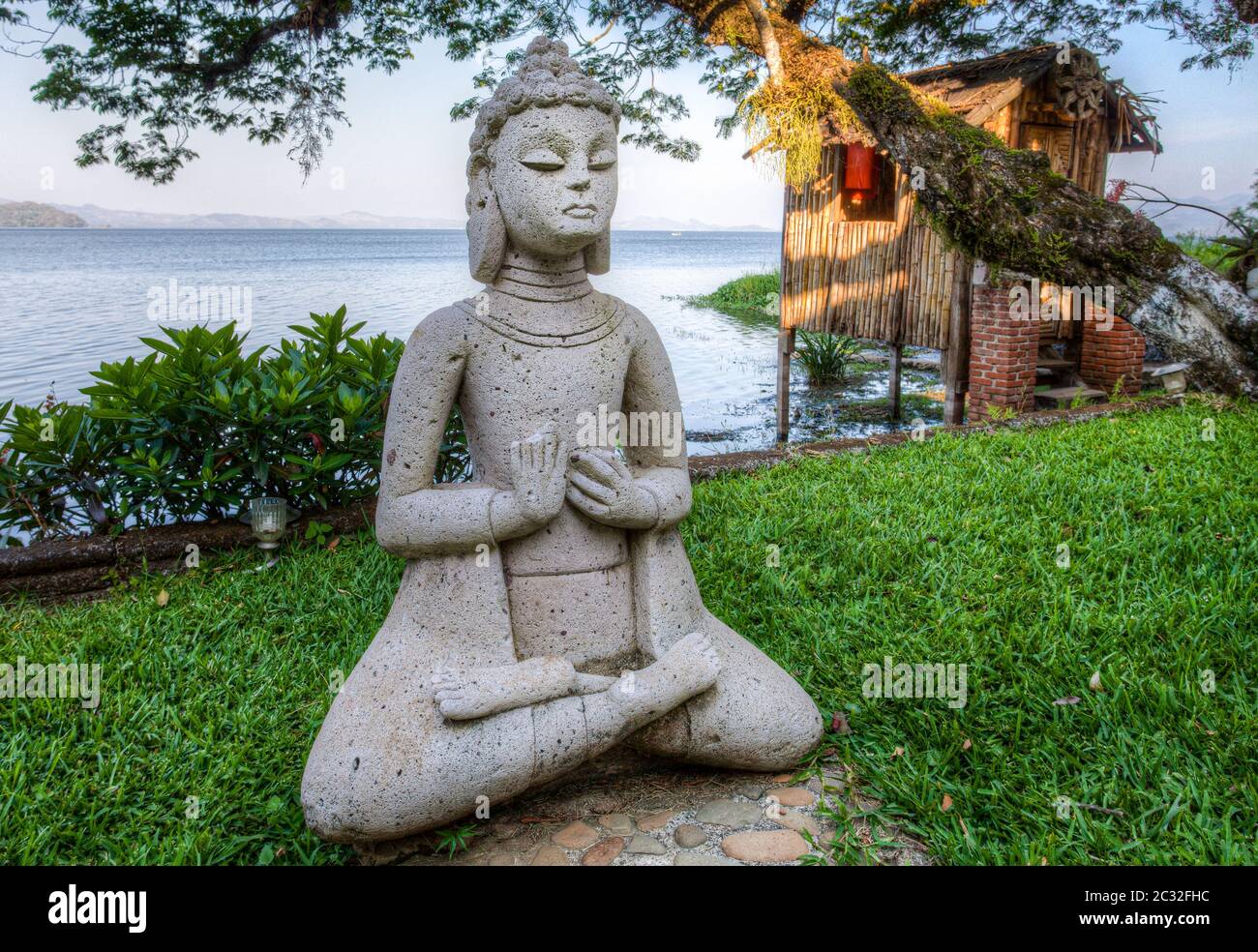 Stone sculpture of an oriental woman in a Buddha pose near Lake Catemaco, Veracruz, Mexico. Stock Photo