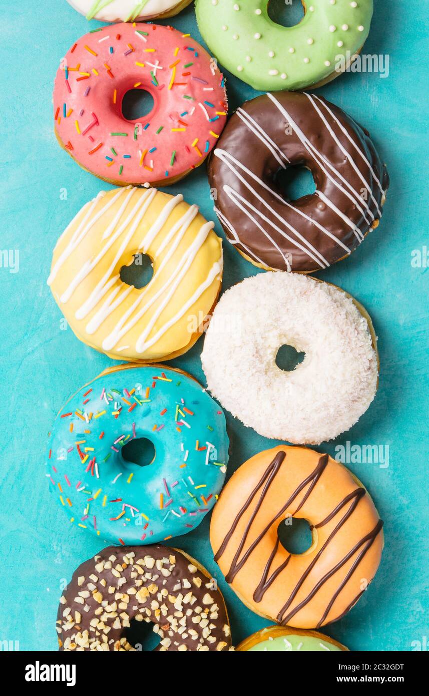 donuts on blue background, top view Stock Photo