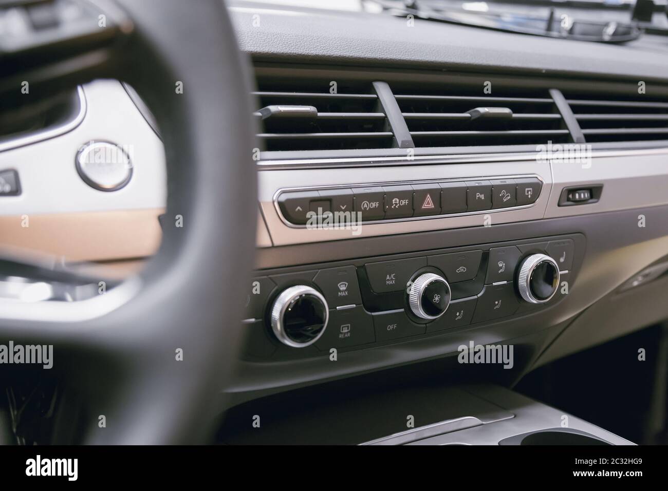 Air ducts and climate control panel in a luxury car with leather top