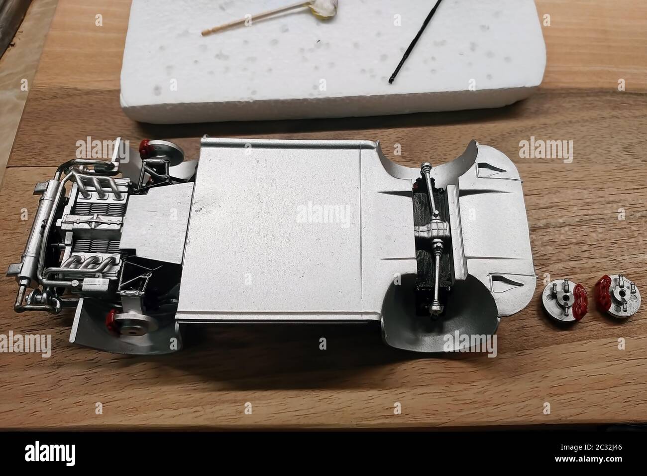 Build a scale model of the car. Glued and painted engine, exhaust