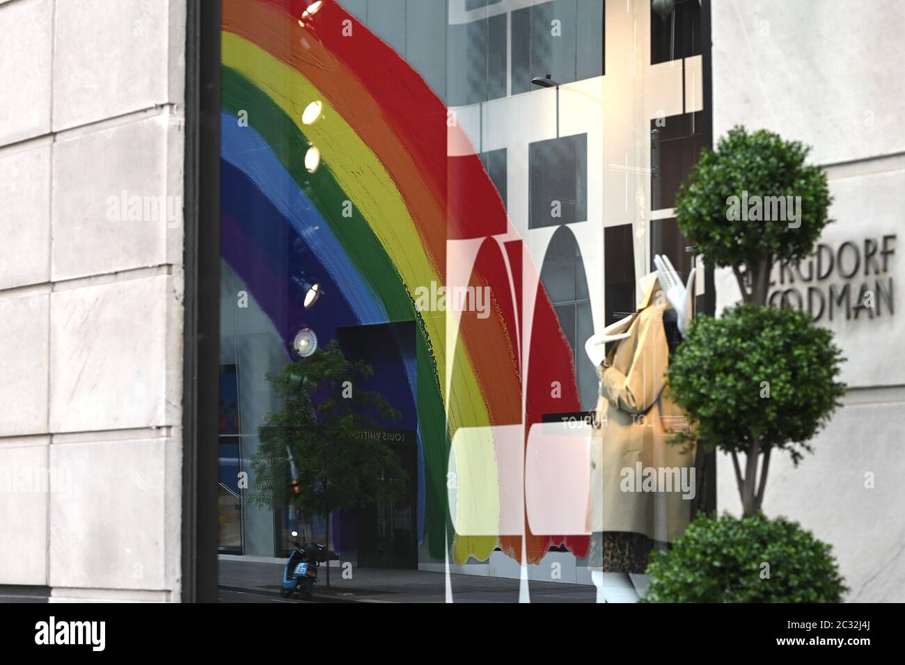 New York City, USA. 18th June, 2020. A view of the newly opened (curbsidee  pickup only) Louis Vuitton 5th Ave. flagship store, decorated with a large  rainbow in honor of “Pride Month”