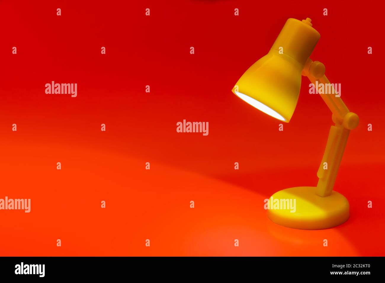 Desk lamp on red Stock Photo