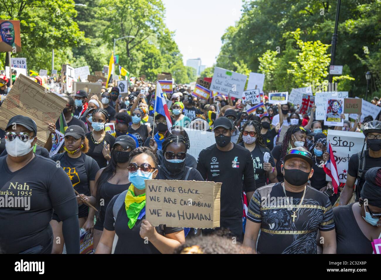 Marchers in the Flatbush neighborhood, predominantly African American, Caribbean & Haitian American, head towards Grand Army Plaza on the 18th day of demonstrations since the murder of George Floyd in Brooklyn, NY. Stock Photo