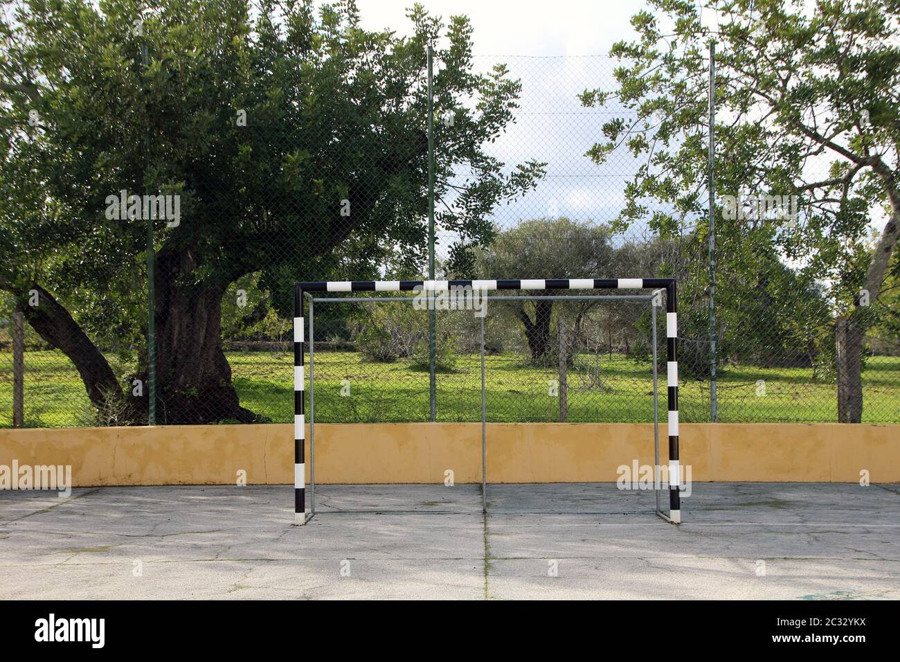 black and white soccer goal net on a concrete soccer surface camp Stock