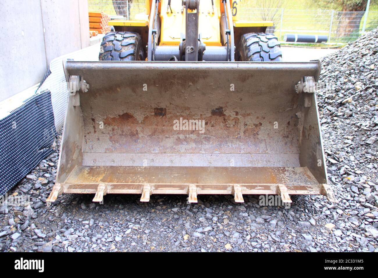 Teeth on a bucket on a wheel loader Stock Photo Alamy
