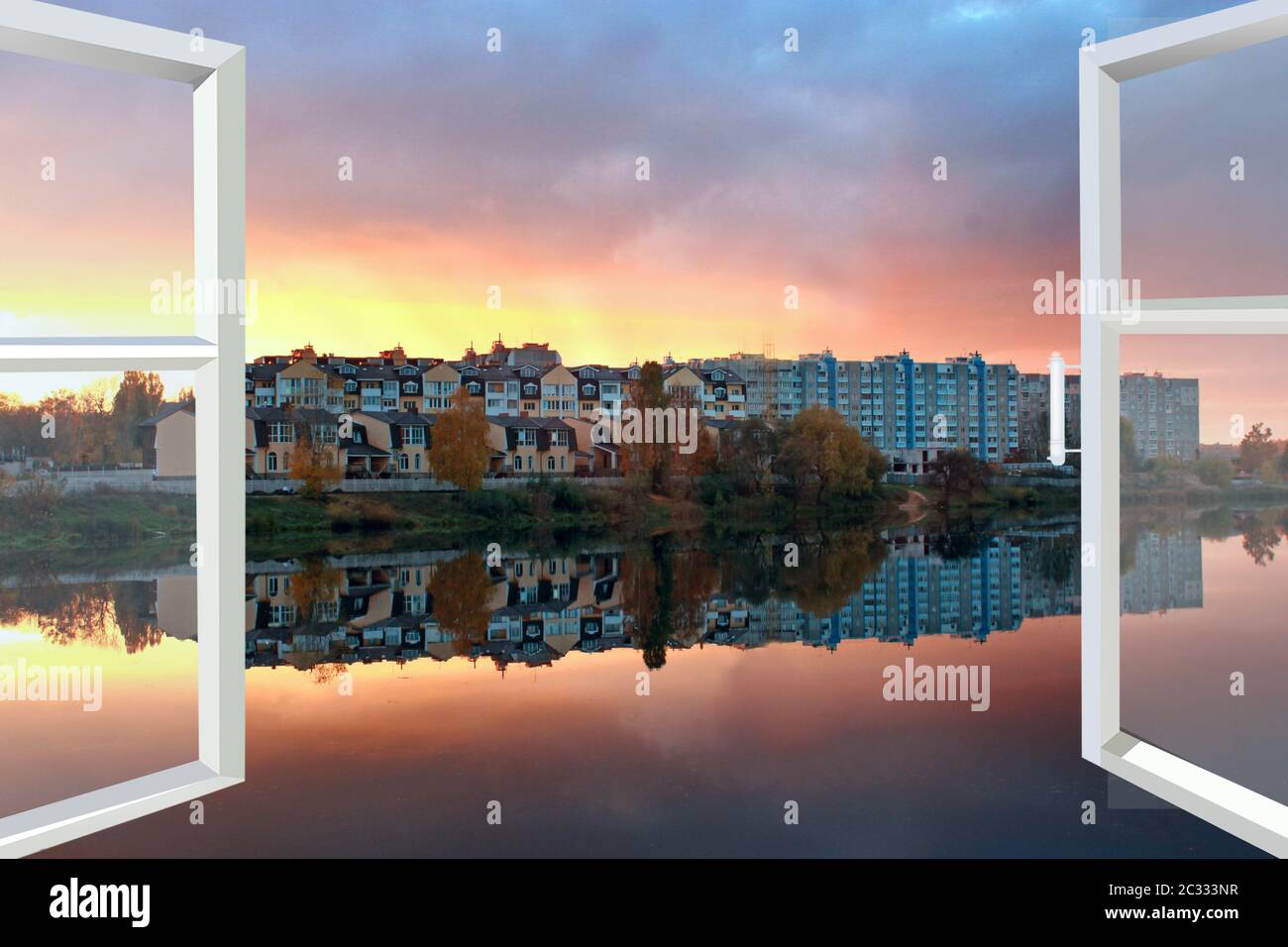 Window with view to beautiful sunset landscape and modern buildings reflected in lake Stock Photo