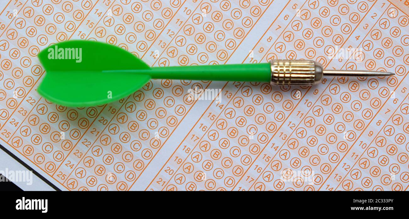 exam paper, dart and exam pen eraser together Stock Photo Alamy