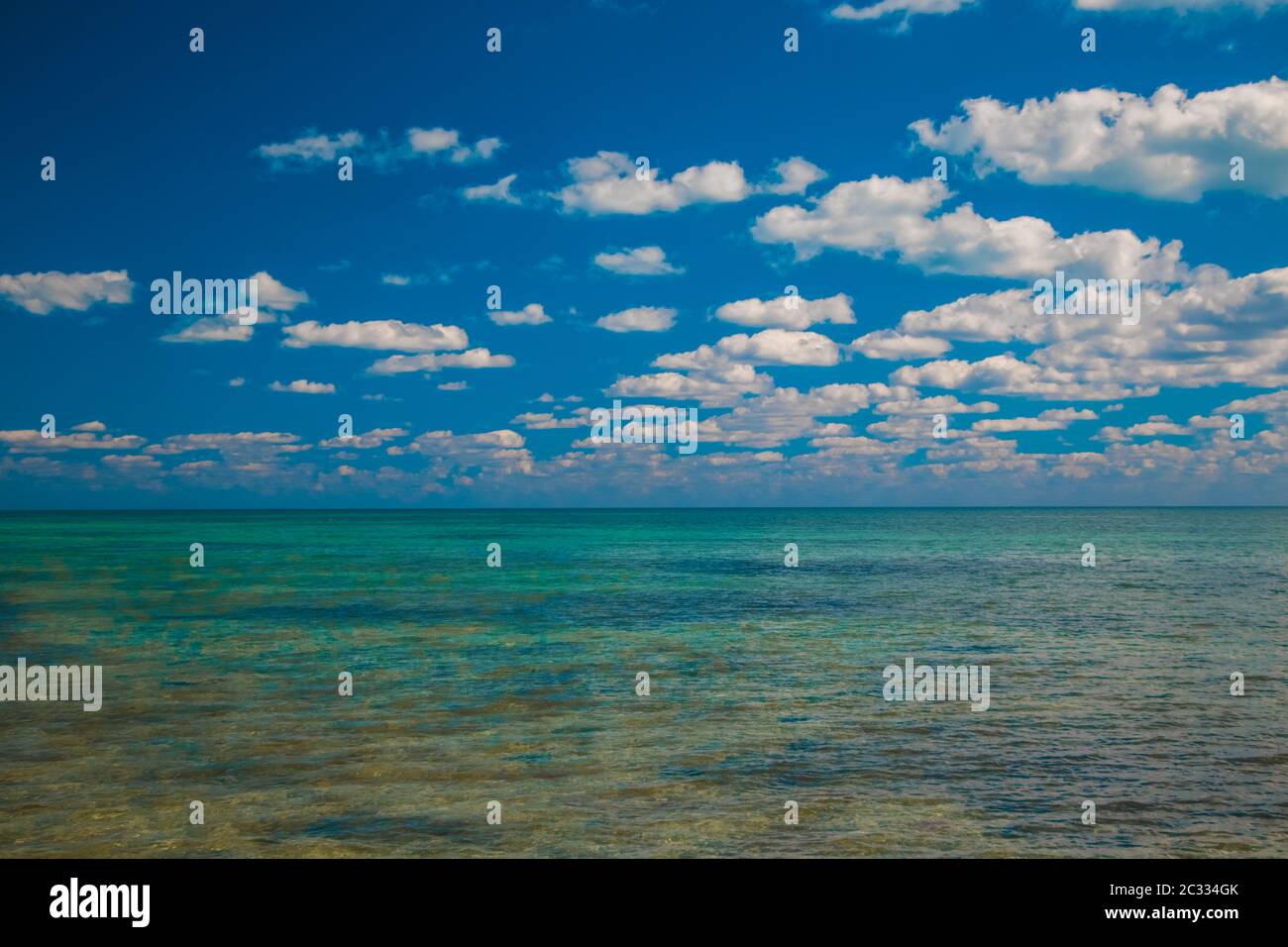 Clouds filling the sky above the flats south of Key Largo. Stock Photo
